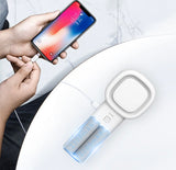 image of someone plugging their phone into the lash fan